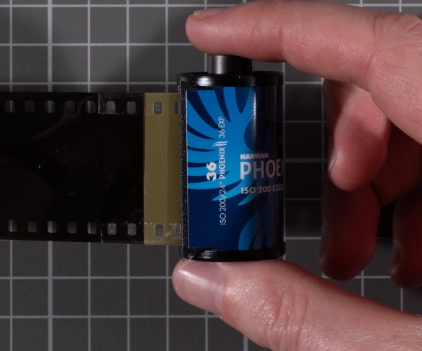 Tape foleded over top and bottom of both pieces of film